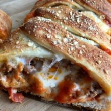 Freshly Baked Italian Bread Stuffed with Pepperoni, Italian Sausage and Meatballs